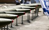 Some of the 40 rockets put on display by the IDF along the docks of the southern port of Eilat, Monday, March 10, 2014 (photo credit: AFP/Jack Guez)