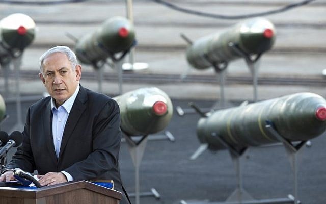 Prime Minister Benjamin Netanyahu speaks in Eilat on March 10, with the Iranian missile shipment behind him (photo credit: AFP/Jack Guez) Prime Minister Benjamin Netanyahu speaks in Eilat on March 10, with the Iranian missile shipment behind him (photo credit: AFP/Jack Guez)