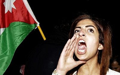 A Jordanian woman shouts anti-Israeli slogans during a protest in front of the Israeli Embassy in Amman, Jordan, on March 10, 2014 (photo credit: AFP/Khalil Mazraawi)