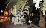 Israelis run for cover as air raid sirens sound in the Israeli city of Sderot on March 12, 2014. (AFP/David Buimovitch)
