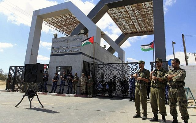 Members of Hamas' security forces standing guard in front of the Rafah border crossing with Egypt in the southern Gaza Strip, September 16, 2013. (photo credit: AFP PHOTO/SAID KHATIB) Members of Hamas' security forces standing guard in front of the Rafah border crossing with Egypt in the southern Gaza Strip, September 16, 2013. (photo credit: AFP PHOTO/SAID KHATIB)