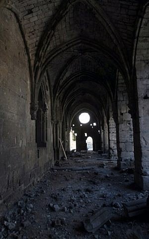 A picture taken on March 21, 2014, shows the damage in the renowned Crusader castle Krak des Chevaliers near the Syria-Lebanon border, in the Homs region, about 200 kms northwest of the capital Damascus. (photo credit: AFP/STR)