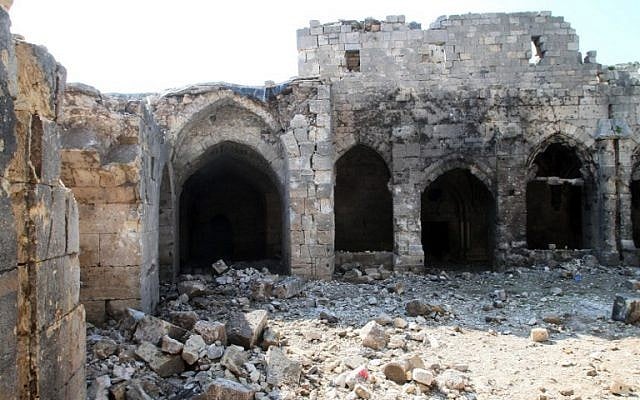 A picture taken on March 21, 2014, shows the damage in the renowned Crusader castle Krak des Chevaliers near the Syria-Lebanon border, in the Homs region, about 200 kms northwest of the capital Damascus. (photo credit: AFP/STR)