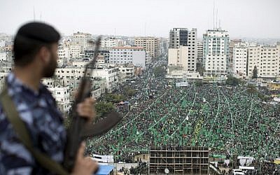 Palestinian supporters of Hamas mark the 10th anniversary of the assassination of Sheikh Ahmed Yassin in Gaza City, on March 23, 2014. (photo credit: AFP/Mahmud Hams)