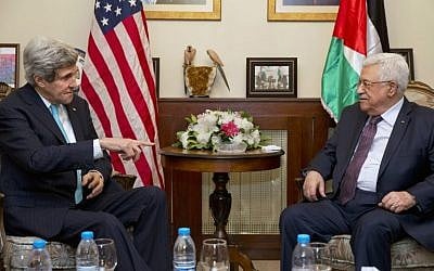 US Secretary of State John Kerry (L) meets with Palestinian Authority President Mahmud Abbas in the Jordanian capital Amman, on Wednesday, March 26, 2014 (photo credit: AFP/Jacquelyn Martin/POOL)