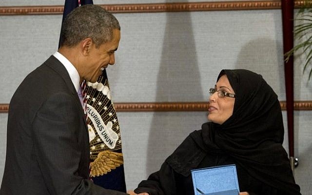US President Barack Obama (L) presents Dr. Maha Al-Muneef, founder and executive director of the National Family Safety Program, with the Secretary of State's International Women of Courage Award in Riyadh, Saudi Arabia, on March 29, 2014. (photo credit: AFP/Saul Loeb) US President Barack Obama (L) presents Dr. Maha Al-Muneef, founder and executive director of the National Family Safety Program, with the Secretary of State's International Women of Courage Award in Riyadh, Saudi Arabia, on March 29, 2014. (photo credit: AFP/Saul Loeb)
