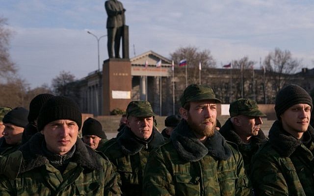 Pro-Russian volunteers gather in a square next to the Council of Ministers of Crimea's building, in Simferopol, on March 14, 2014 (photo credit: AFP/Daniel Leal Olivas) Pro-Russian volunteers gather in a square next to the Council of Ministers of Crimea's building, in Simferopol, on March 14, 2014 (photo credit: AFP/Daniel Leal Olivas)