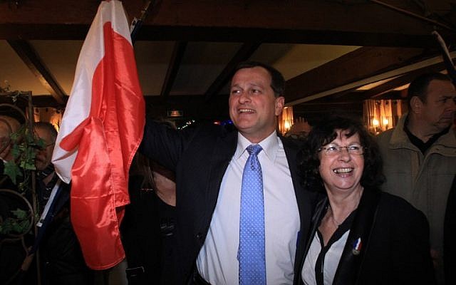 FRANCE, Perpignan : French far-right party National Front (FN) party candidate Louis Aliot is greeted by supporters after the first results were announced at the end of the first round of the French municipal elections in Perpignan on March 23, 2014. (photo credit: AFP PHOTO/ RAYMOND ROIG) FRANCE, Perpignan : French far-right party National Front (FN) party candidate Louis Aliot is greeted by supporters after the first results were announced at the end of the first round of the French municipal elections in Perpignan on March 23, 2014. (photo credit: AFP PHOTO/ RAYMOND ROIG)