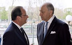 French President Francois Hollande (left) talks with French Minister of Foreign Affairs Laurent Fabius on March 27, 2014. (photo credit: AFP/ALAIN JOCARD)