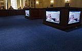 The Maryland House Ways and Means Committee watches a video of late Holocaust survivor Leo Bretholz, who died March 8, 2014 just days before he was due to testify on a Holocaust reparations bill in Annapolis, MD, March 10, 2013 (photo credit: AFP/Jim Watson)