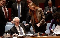 US Ambassador to the UN Samantha Power talks with her Russian counterpart Vitaly Churkin prior to a vote on a resolution on Ukraine during a United Nations Security Council emergency meeting at UN headquarters in New York on March 15, 2014. (photo credit: AFP/Emmanuel Dunand)