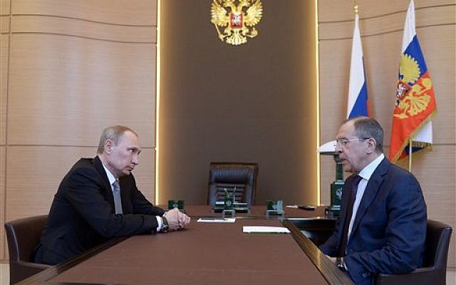 Russian President Vladimir Putin, left listens to Foreign Minister Sergey Lavrov, right, during their meeting at the Bocharov Ruchei residence in Sochi, southern Russia, Monday, March 10, 2014. (photo credit: ap/RIA-Novosti, Alexei Nikolsky, Presidential Press Service) Russian President Vladimir Putin, left listens to Foreign Minister Sergey Lavrov, right, during their meeting at the Bocharov Ruchei residence in Sochi, southern Russia, Monday, March 10, 2014. (photo credit: ap/RIA-Novosti, Alexei Nikolsky, Presidential Press Service)