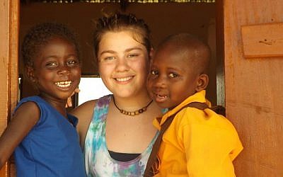 Jessica Baer in Ghana with two of the former child slaves rescued by Breaking the Chain through Education. (Courtesy of Michael Baer/JTA)