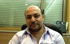 Joint List MK Masud Ganaim at his Knesset office, March 10, 2014 (Elhanan Miller/Times of Israel)