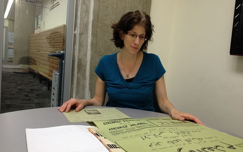 Raquel Ukeles, curator of the Islam and Middle East collection at Israel's National Library displays posters scanned and uploaded to the internet, March 23, 2014 (photo credit: Elhanan Miller/Times of Israel)