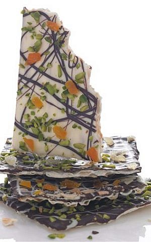 This product image released by Martha Stewart Living shows a recipe for chocolate covered matzah, topped with nuts and dried fruit. (phot credit: AP/Martha Stewart Living)