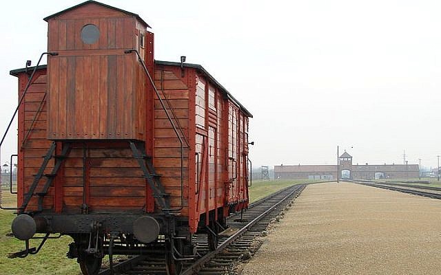 An original railway carriage stands at the Judenrampe platform at Auschwitz (photo credit: Adam Jones/Wikimedia Commons) An original railway carriage stands at the Judenrampe platform at Auschwitz (photo credit: Adam Jones/Wikimedia Commons)