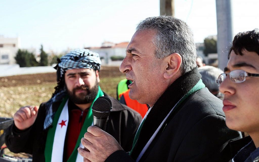 In this Friday, Jan. 6, 2012 photo, Kamal al-Labwani, 54, speaks to a crowd during an anti-Assad rally in Amman, Jordan (photo credit: AP/Mohammad Hannon) In this Friday, Jan. 6, 2012 photo, Kamal al-Labwani, 54, speaks to a crowd during an anti-Assad rally in Amman, Jordan (photo credit: AP/Mohammad Hannon)