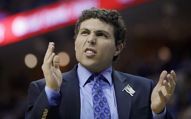 Memphis coach Josh Pastner claps in the first half of an NCAA college basketball game against Louisville in Memphis, Tennessee, Saturday, March 1, 2014. (photo credit: AP/Danny Johnston)