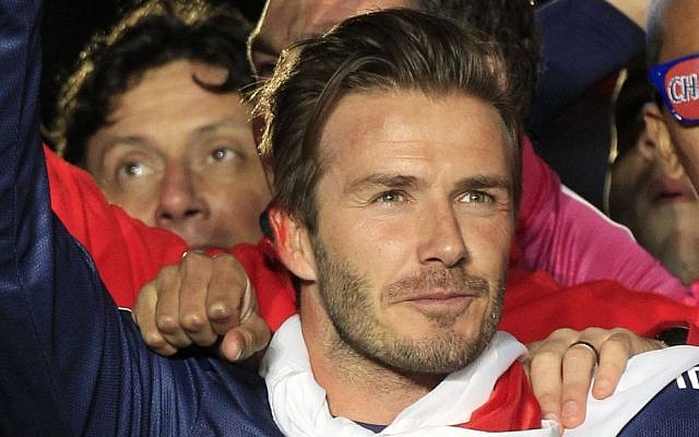 Illustrative: David Beckham celebrates Paris Saint-Germain's French League One title, at the Parc des Princes stadium, in Paris, Saturday, May 18, 2013. This match was his final home game for Paris Saint-Germain before retirement. (photo credit: AP Photo/Thibault Camus) Illustrative: David Beckham celebrates Paris Saint-Germain's French League One title, at the Parc des Princes stadium, in Paris, Saturday, May 18, 2013. This match was his final home game for Paris Saint-Germain before retirement. (photo credit: AP Photo/Thibault Camus)