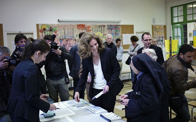 Candidate from the conservative UMP political party, Nathalie Kosciusko-Morizet, centre, prepares to vote in municipal elections in Paris, Sunday, March 30, 2014. (photo credit: AP/Thibault Camus) Candidate from the conservative UMP political party, Nathalie Kosciusko-Morizet, centre, prepares to vote in municipal elections in Paris, Sunday, March 30, 2014. (photo credit: AP/Thibault Camus)
