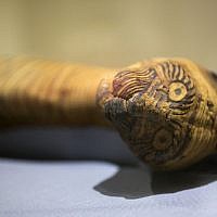 A cat mummy, is displayed as part of the exhibit "Soulful Creatures: Animal Mummies in Ancient Egypt," at the Orange County's Bowers Museum in Santa Ana, Calif. (photo credit: AP/Damian Dovarganes)