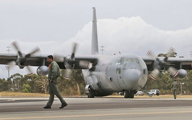 A Royal Malaysian Air Force C-130 Hercules taxies along the tarmac at RAAF Base Pearce to to help with the search for debris or wreckage of the missing Malaysia Airlines Flight MH370 in Perth, Australia, Saturday, March 29, 2014. (photo credit: AP/Rob Griffith) A Royal Malaysian Air Force C-130 Hercules taxies along the tarmac at RAAF Base Pearce to to help with the search for debris or wreckage of the missing Malaysia Airlines Flight MH370 in Perth, Australia, Saturday, March 29, 2014. (photo credit: AP/Rob Griffith)