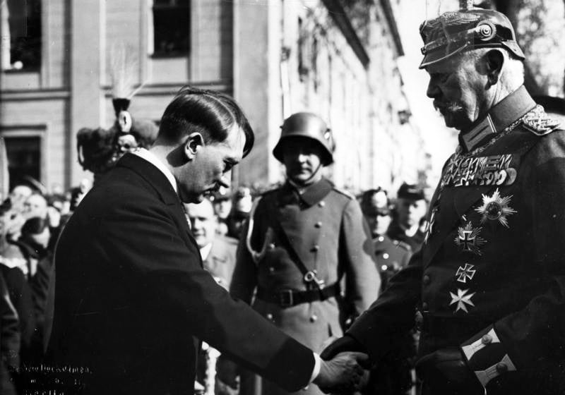Adolf Hitler bows and shakes the hand of Paul von Hindenburg, March 21, 1933 (photo credit: Theo Eisenhart/Federal German Archive)