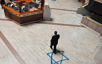 Blue Stars of David painted in the foyer of the Amman courthouse where Jordanian-Palestinian judge Raed Zeiter, killed while crossing into the West Bank, worked. (photo credit: Michal Shmulovich)
