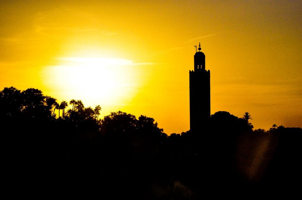 A view of Marrakech's tree tops and its famed Koutoubia Mosque at sunset. (photo credit: Michal Shmulovich)