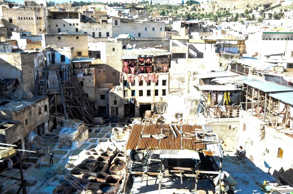 A view of the tanneries, where Moroccans produce fine leather goods, with buildings in the background, in Fez, a city famous for its craftwork and skilled aristry, to which the Jewish community also contributed. (photo credit: Michal Shmulovich