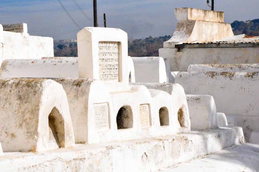 The Jews in Fez had a mixed existence -- at times, the community flourished, as it did during its golden age between the 9th and 11th centuries CE. During other periods, Jews were subjected to violent uprisings, and were expelled and killed. Pictured here are the burial sites of important Moroccan Jews, as evidenced by the large gravestones. (photo credit: Michal Shmulovich)