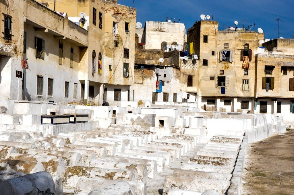 A view of the Jewish cemetery in Fez, with homes in the background. (photo credit: Michal Shmulovich)