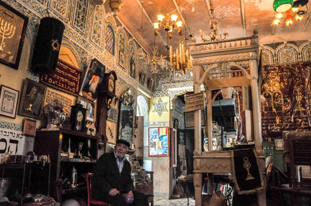 Edmond Milmoun Gabay in the Habarim Synagogue's museum of Jewish memorabilia in Fez. (photo credit: Michal Shmulovich)