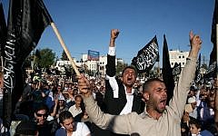 Supporters of Hizb ut-Tahrir demonstrate in Ramallah,  July 7, 2012 (photo credit: Issam Rimawi/Flash90)