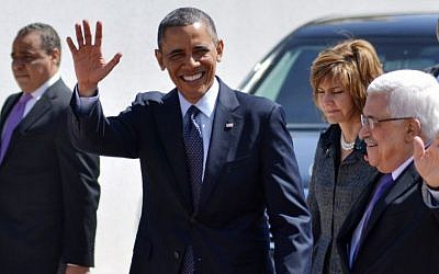 US President Barack Obama and PA President Mahmoud Abbas wave to the crowd during Obama's visit to Ramallah, March 21, 2013 (photo credit: Issam Rimawi/Flash90)