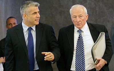 Finance Minister Yair Lapid and Attorney General Yehuda Weinstein attend a cabinet meeting in April 2013. Weinstein said that the government couldn't support a key part of Lapid's new housing bill (photo credit: Alex Kolomoisky/POOL/FLASH90)