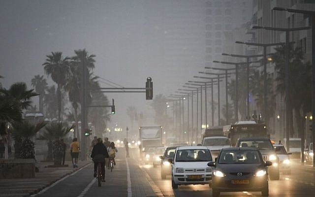 People bicycle on Tel Aviv's hazy beachfront boardwalk during a sandstorm on Sunday, March 2, 2014. (photo credit: Hadas Parush/Flash 90) People bicycle on Tel Aviv's hazy beachfront boardwalk during a sandstorm on Sunday, March 2, 2014. (photo credit: Hadas Parush/Flash 90)
