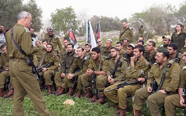 IDF Chief of Staff Benny Gantz speaks with soldiers during a visit to the Netzah Yehuda Battalion near Jenin, on Sunday, March 2, 2014. (photo credit: IDF Spokesperson/Flash90)