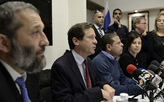 Labor leader Isaac Herzog, center, speaking to the press in the Knesset alongside Shas leader Aryeh Deri, left, and Meretz leader Zahava Gal-on, seated far-right, March 10, 2014. (Tomer Neuberg/Flash90) Labor leader Isaac Herzog, center, speaking to the press in the Knesset alongside Shas leader Aryeh Deri, left, and Meretz leader Zahava Gal-on, seated far-right, March 10, 2014. (Tomer Neuberg/Flash90)