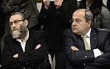 MK Ahmad Tibi, right, with United Torah Judaism's MK Moshe Gafni, left, at a meeting of the Knesset opposition, March 9, 2014. (Tomer Neuberg/Flash90)