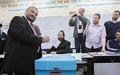 Bet Shemesh mayoral candidate Moshe Abutbul casts his vote at a polling station, during the second round of the local elections in the city, March 11, 2014. (Yonatan Sindel/Flash90)
