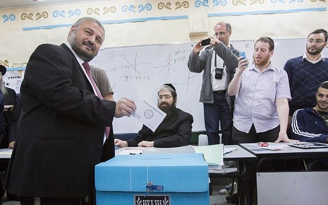 Bet Shemesh mayoral candidate Moshe Abutbul casts his vote at a polling station, during the second round of the local elections in the city, March 11, 2014. (Yonatan Sindel/Flash90) Bet Shemesh mayoral candidate Moshe Abutbul casts his vote at a polling station, during the second round of the local elections in the city, March 11, 2014. (Yonatan Sindel/Flash90)