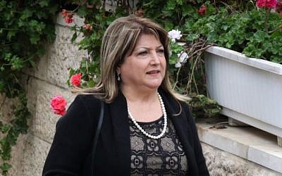 Shula Zaken, former Prime Minister Ehud Olmert's bureau chief, leaves her home in Jerusalem on March 30, 2014 (photo credit: Meital Cohen/Flash90)
