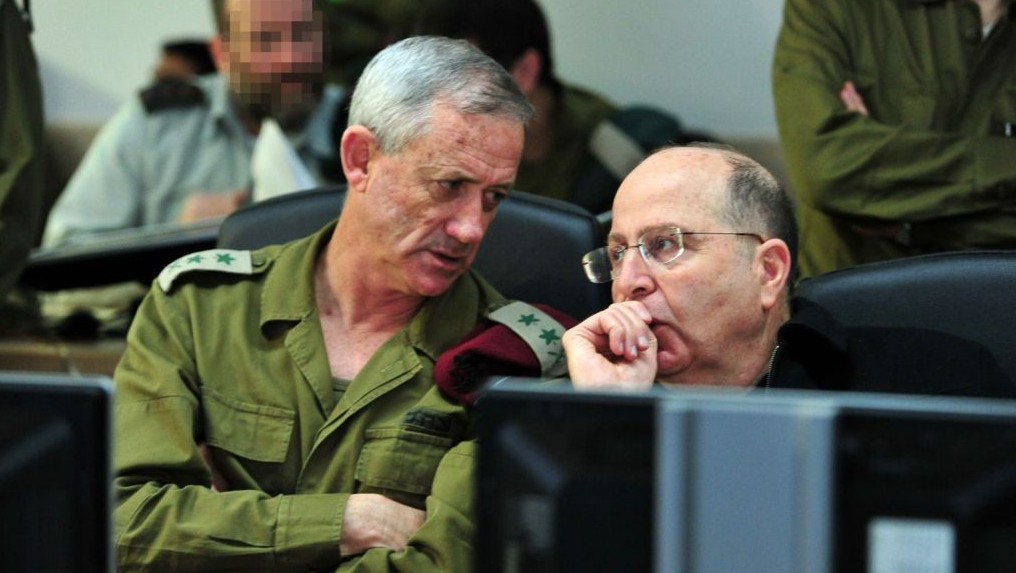 IDF Chief of Staff Benny Gantz confers with Defense Minister Moshe Ya'alon at the Navy war room during Wednesday morning's operation by naval commandos during which they captured a Iranian shipment of weapons on its way to Gaza (photo credit: Ariel Hermoni/ Ministry of Defense) IDF Chief of Staff Benny Gantz confers with Defense Minister Moshe Ya'alon at the Navy war room during Wednesday morning's operation by naval commandos during which they captured a Iranian shipment of weapons on its way to Gaza (photo credit: Ariel Hermoni/ Ministry of Defense)