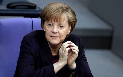 German Chancellor Angela Merkel attends a meeting of the German parliament, the Bundestag, in Berlin, on Thursday, March 20, 2014. (photo credit: AP/Michael Sohn)