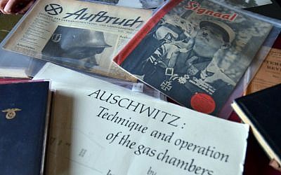 This Feb. 27, 2014 photo made available by the University of Colorado shows a few examples from the extensive Mazal Holocaust Collection. (AP Photo/Glenn Asakawa, University of Colorado)