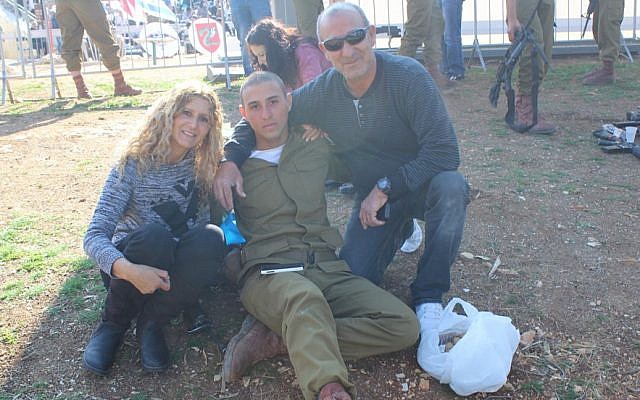 As did many families, Yaela and Avi Elimelech brought homemade cookies for their son, Idan, during the Feb. 18 ceremony at Ammunition Hill during which dozens of paratroopers received their red berets. (The Times of Israel/Rebecca McKinsey) As did many families, Yaela and Avi Elimelech brought homemade cookies for their son, Idan, during the Feb. 18 ceremony at Ammunition Hill during which dozens of paratroopers received their red berets. (The Times of Israel/Rebecca McKinsey)