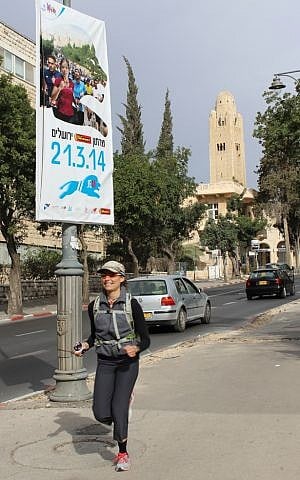 Chaya Bracha Zippor, 38,  didn't think twice about cheering the runners on during the years she decided not to run. “The runners feed off the energy of the crowd, especially during the tough parts,” she said. "It lifts my spirits" (photo credit: Rebecca McKinsey/Times of Israel)