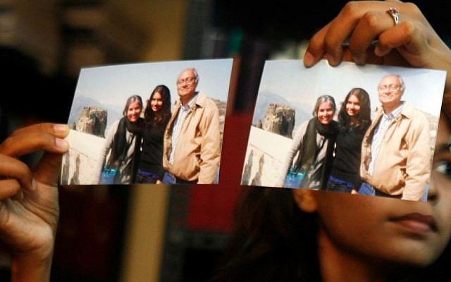 Photographs showing one of the passengers of the missing Malaysian Airlines Boeing 777. (photo credit: AP Photo/Arun Sankar K) Photographs showing one of the passengers of the missing Malaysian Airlines Boeing 777. (photo credit: AP Photo/Arun Sankar K)